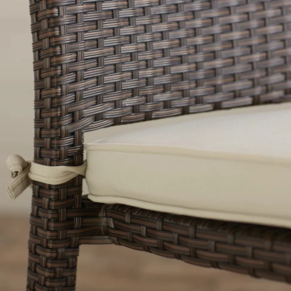 Outdoor rattan wicker patio dining chair with sturdy metal frame and comfortable cushion for garden or balcony use.