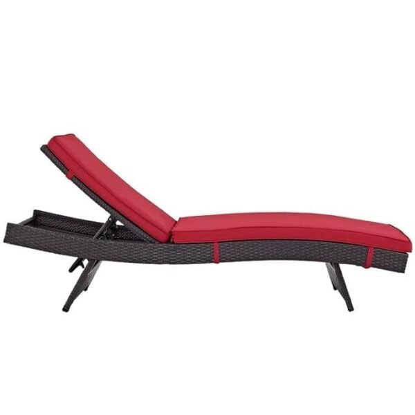 Premium wicker lounge chair set with red cushions, poolside patio, palm trees, and contemporary resort ambiance.