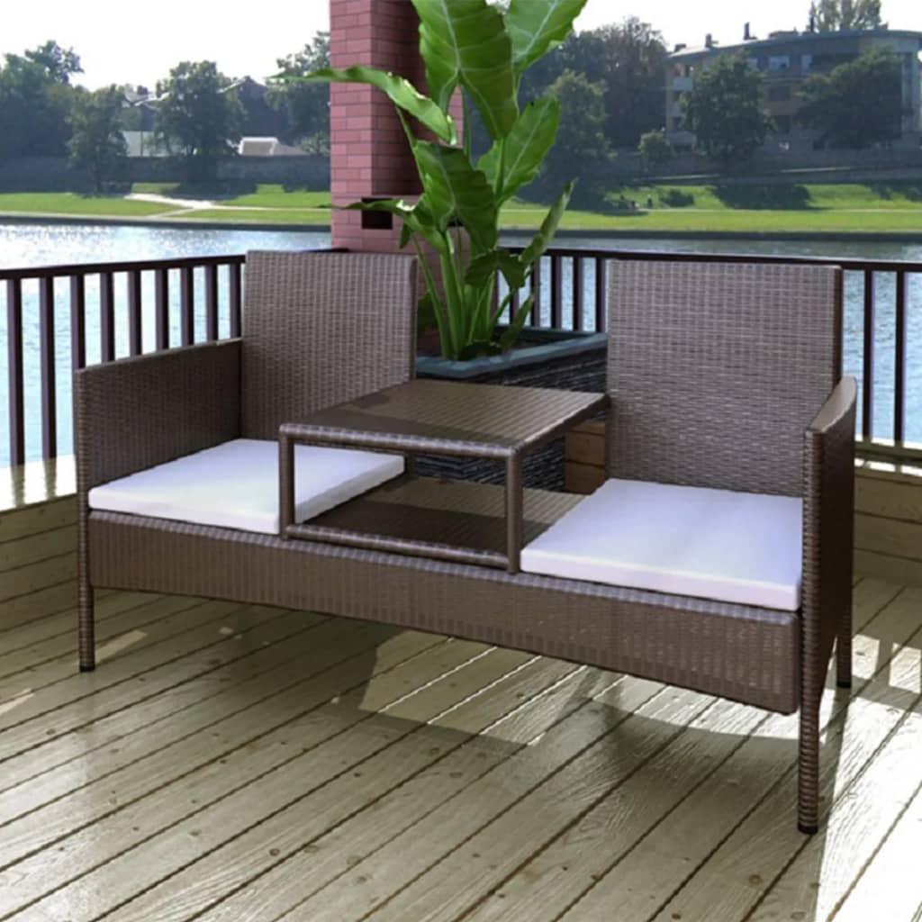 Dark brown 2-seater patio sofa set with tea table, made of durable poly rattan, placed outdoors on a garden deck.