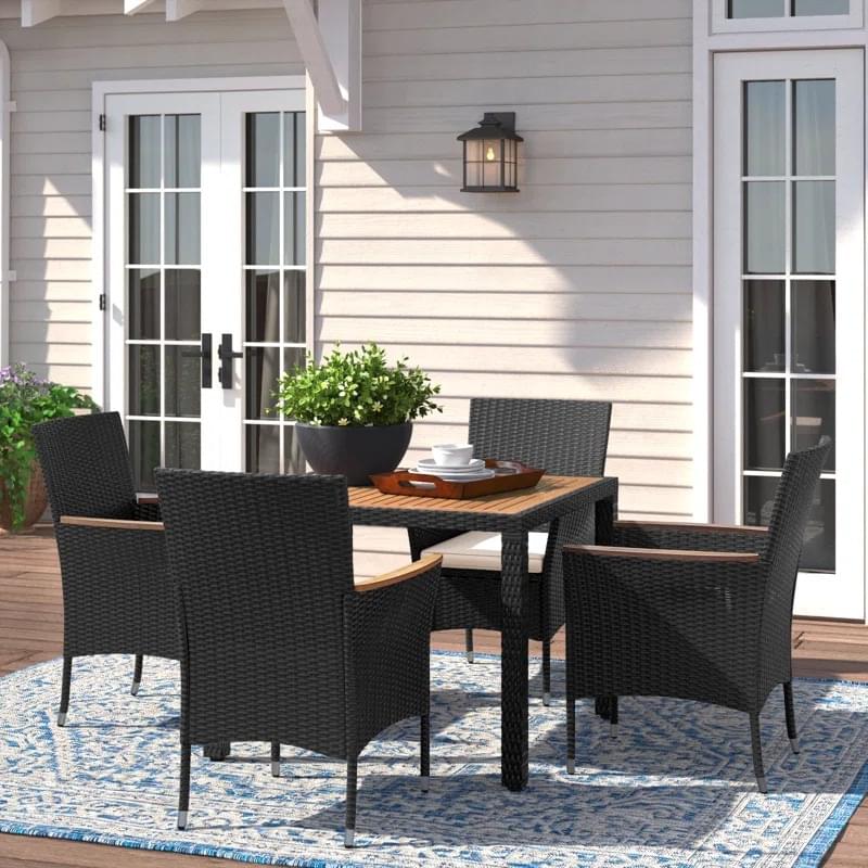 4-person square outdoor dining set with comfortable cushions on a patio